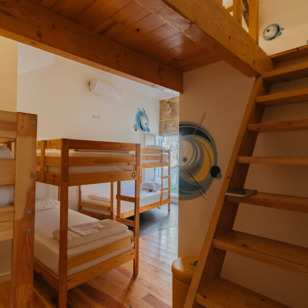 Bed in 8-bed female community room with interior patio at Happy Porto Hostel – top rated hostel Porto